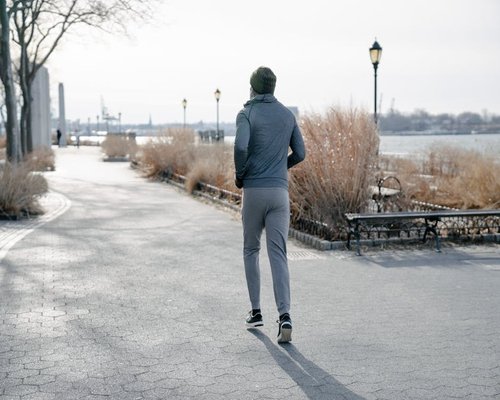 man jogging in the park at sunset